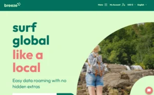 A traveler using Breeze eSIM on their smartphone while exploring a scenic destination.